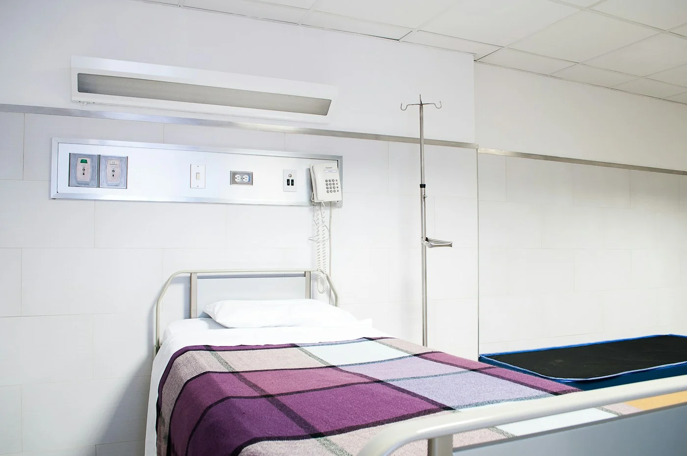 Hospital room with patient-care equipment